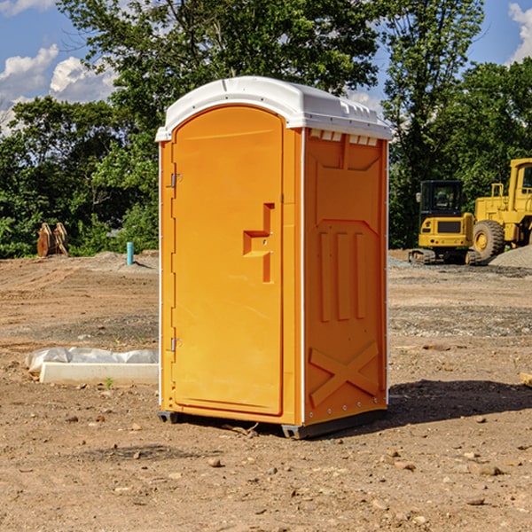 what is the cost difference between standard and deluxe portable restroom rentals in Adair County IA